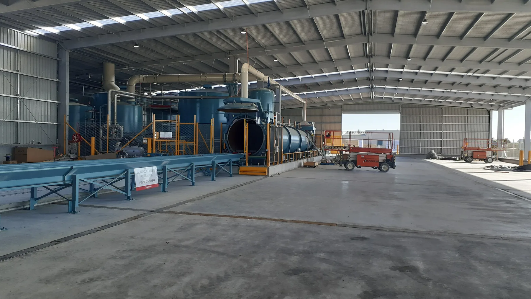 Kiwi Lumber timber treatment plant and material handling equipment
